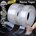 Heavy duty double sided nano tape roll mounted on clear glass surface