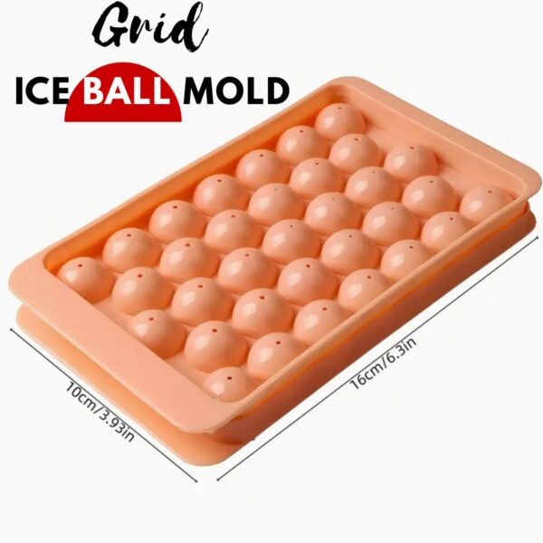 Round ice ball maker mould with dustproof lid filled with ice spheres for cocktails and drinks